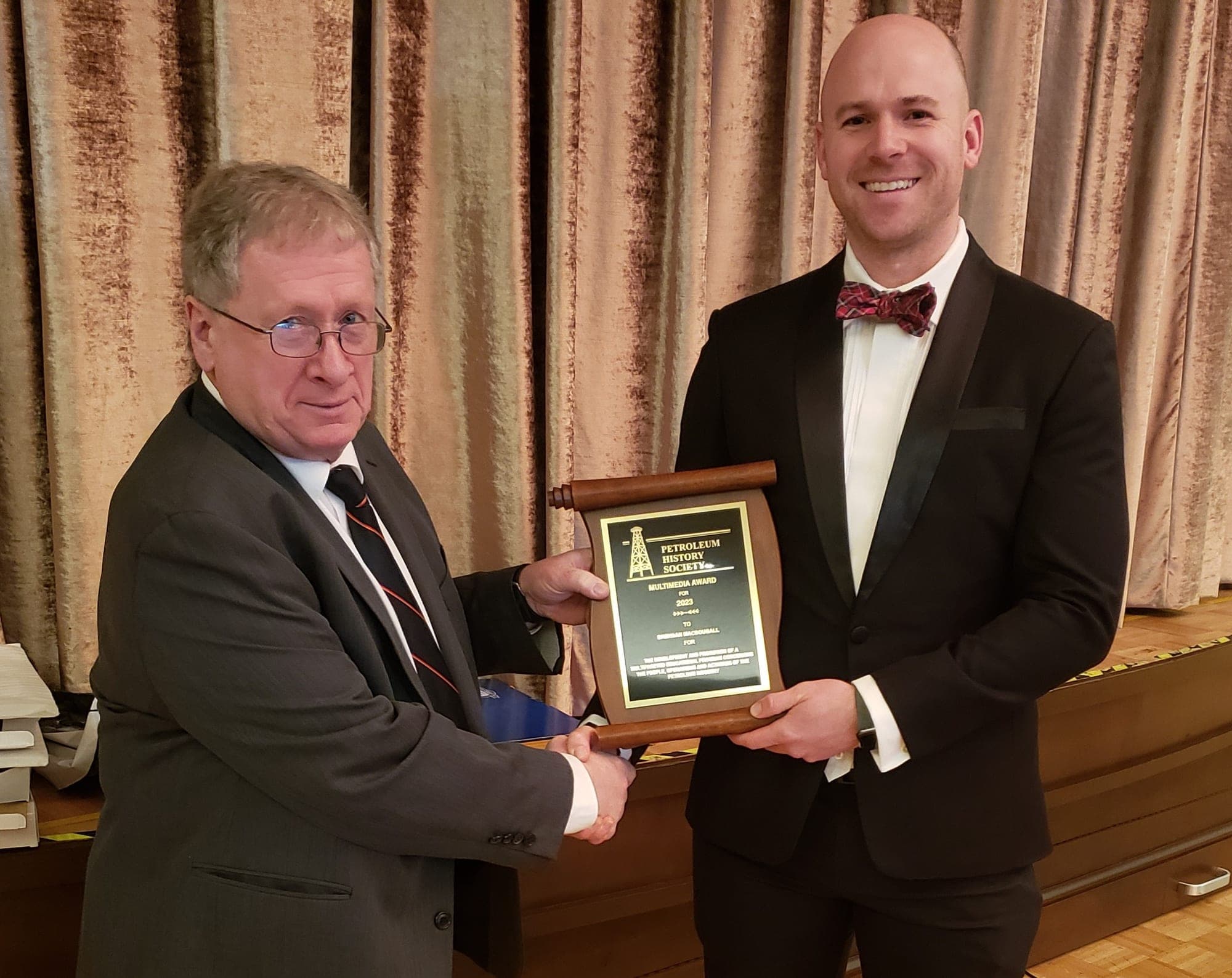 Brendan MacDougall receiving the 2023 Petroleum History Society Multimedia Award in 2024.